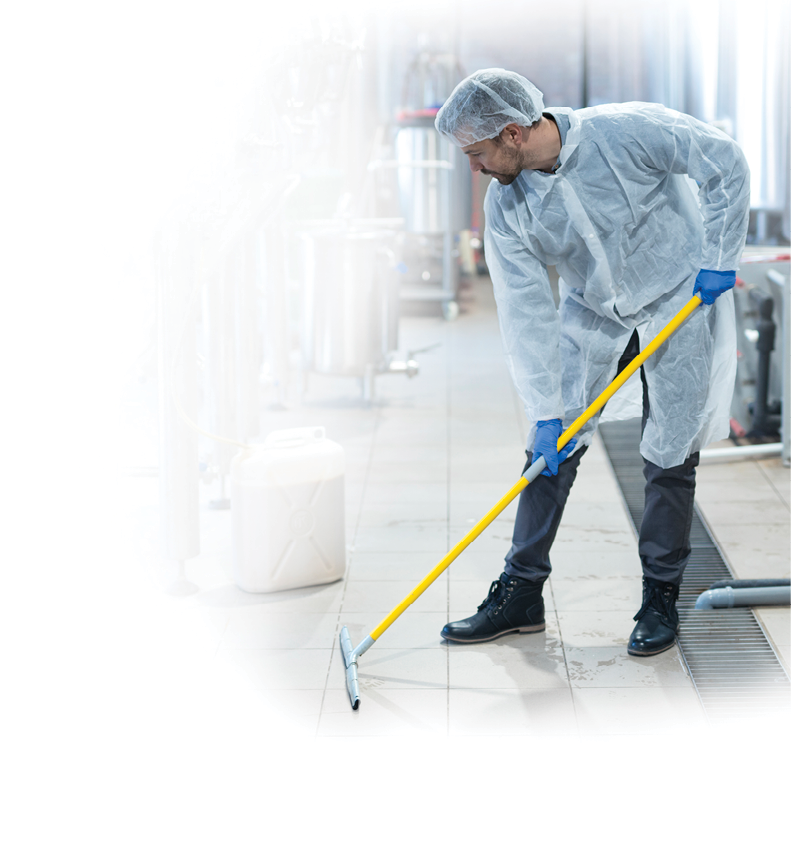 Professional industrial cleaner in protective uniform cleaning floor of food processing plant  Cleaning services 